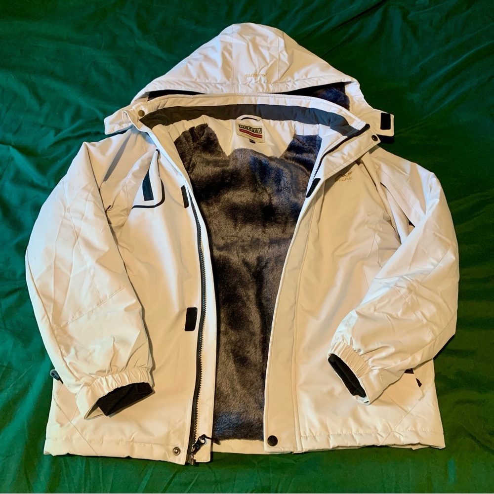 Cream water proof jacket with grey faux fur lined interior